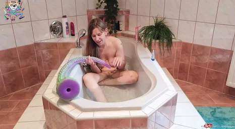 Watch this kinky teen's solo session with a massive tattooed monster in the water